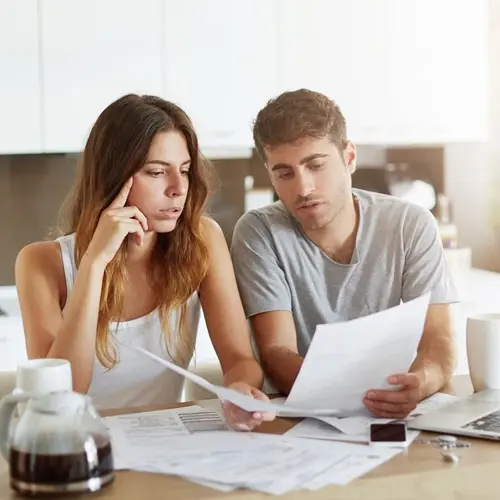 Couple reviewing bills